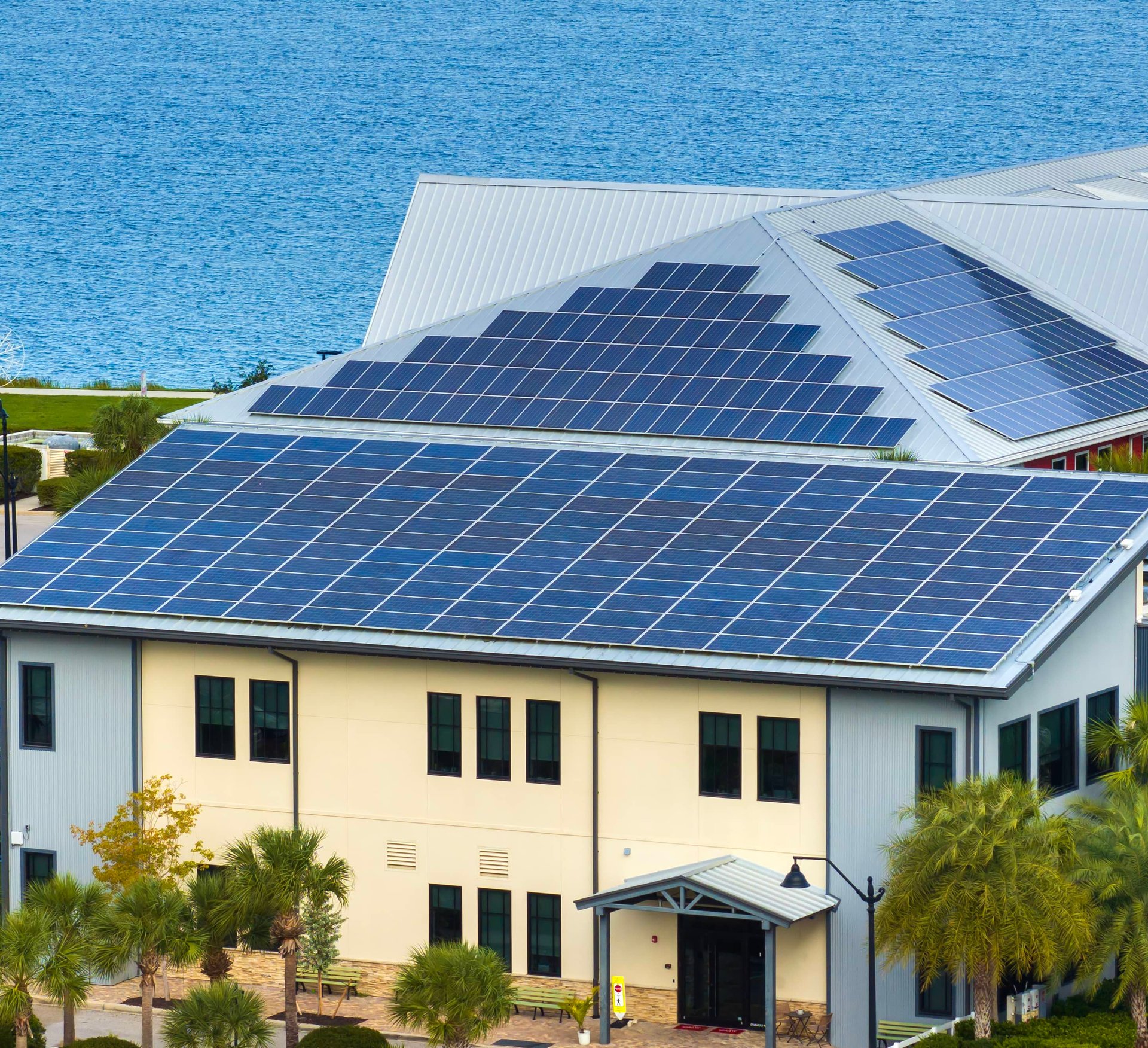 Solar technician installing rooftop solar panels in Florida