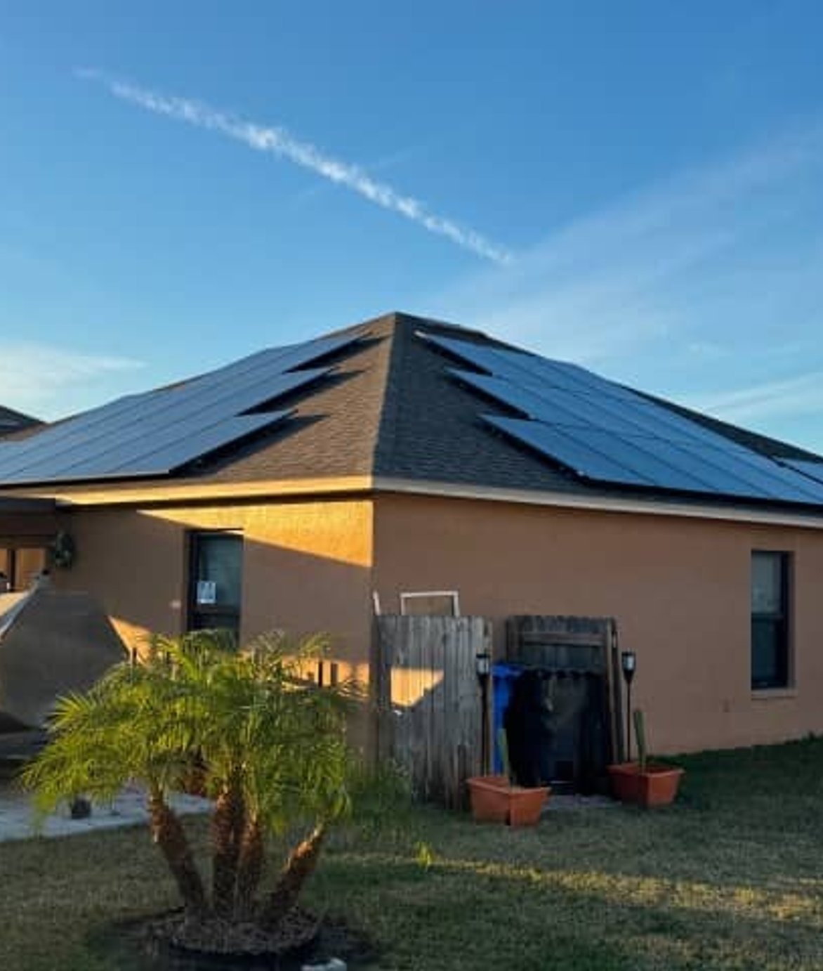 Solar panel installation with technician using tools