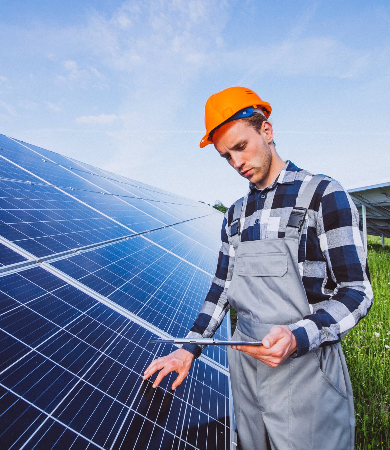 Solar specialist reviewing installation plan with homeowner